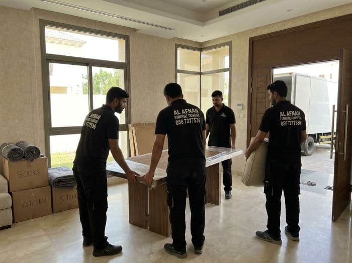 Villa movers in Sharjah professionally handling furniture and household belongings during a large residential relocation